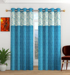 Aqua-colored Camrin patch umbrella curtain from The Digital Kart featuring a vibrant, decorative fabric with umbrella and patch design.