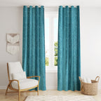 Aqua-colored curtains with Camrin texture from The Digital Kart, hanging on a window showcasing elegant fabric details.