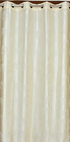 Cream tree punch curtains from The Digital Kart featuring a decorative pattern, perfect for adding elegance to living spaces.