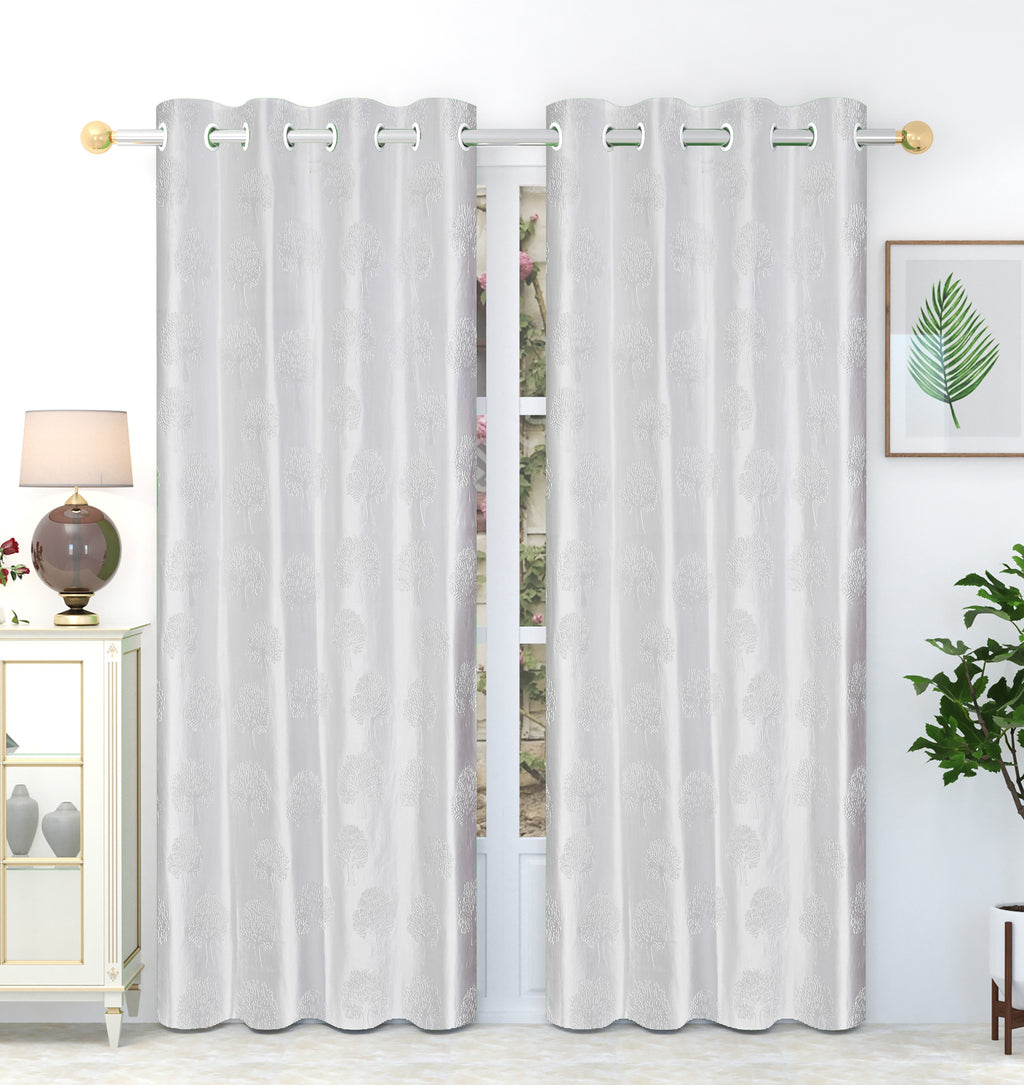 White tree punch curtains by The Digital Kart hanging in a room with natural light, showcasing modern, minimalist window decor.