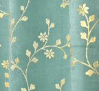 Velvet curtains in a soft sky blue color from APNA FOIL brand, displayed hanging in a home interior setting.